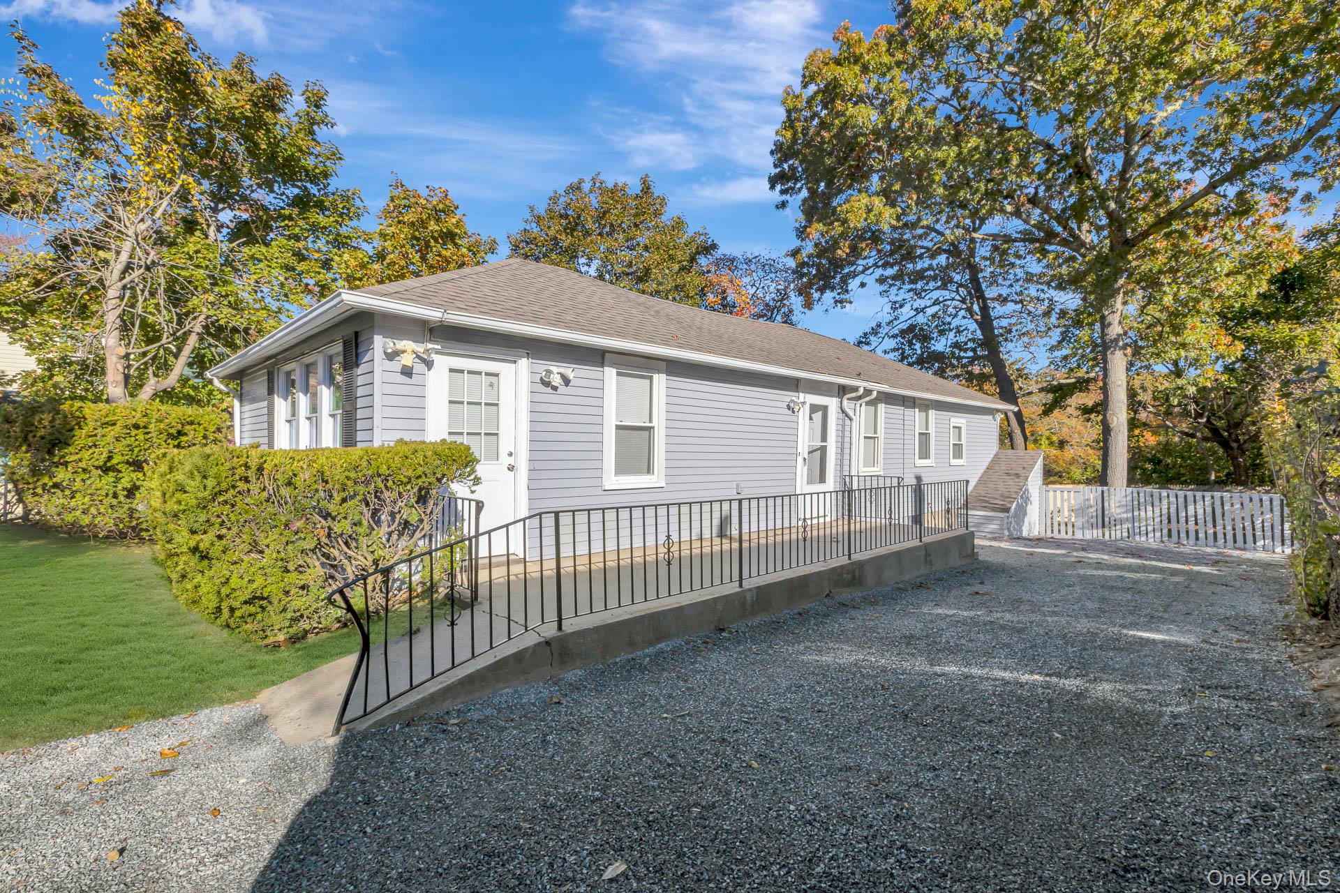 860 Flanders Road Flanders, NY 11901 - Photo 1 of 31 a view of a house with a yard and plants