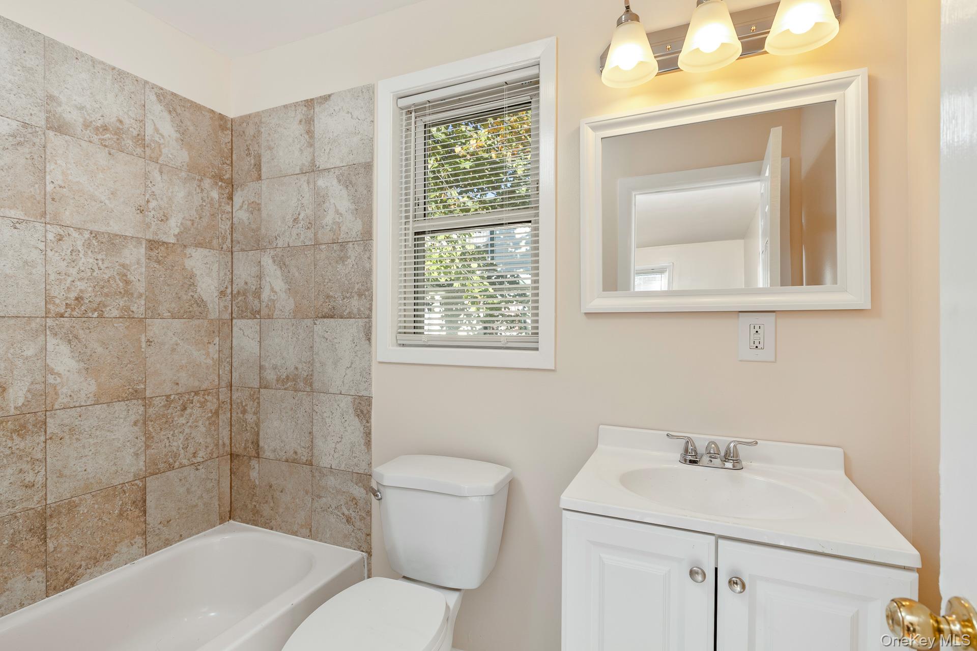860 Flanders Road Flanders, NY 11901 - Photo 14 of 31 a bathroom with a sink toilet and shower