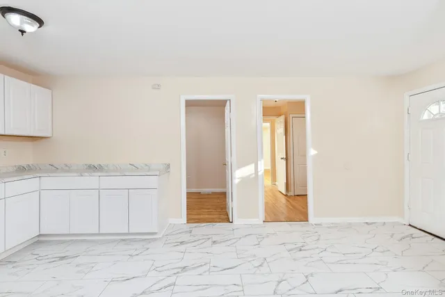 an empty room with cabinet