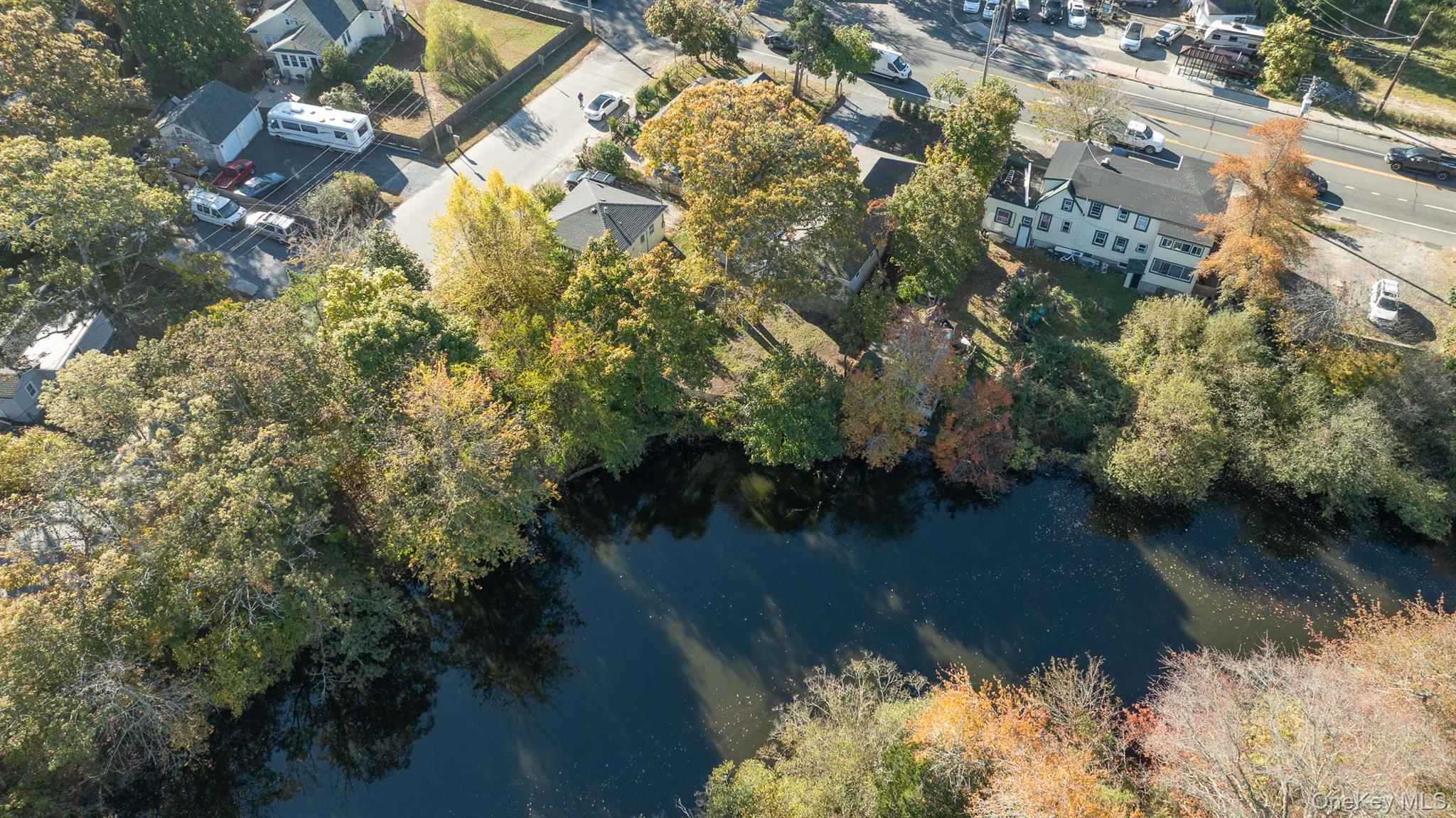 860 Flanders Road Flanders, NY 11901 - Photo 7 of 31 Aerial view of property's location featuring a nearby body of water