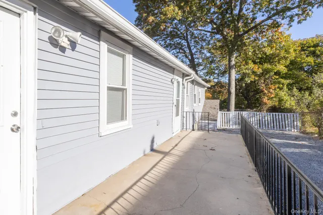 a view of a house with wooden fence