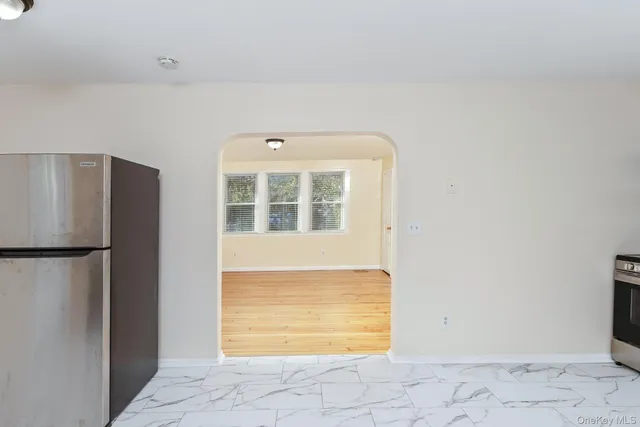 a view of empty room with windows