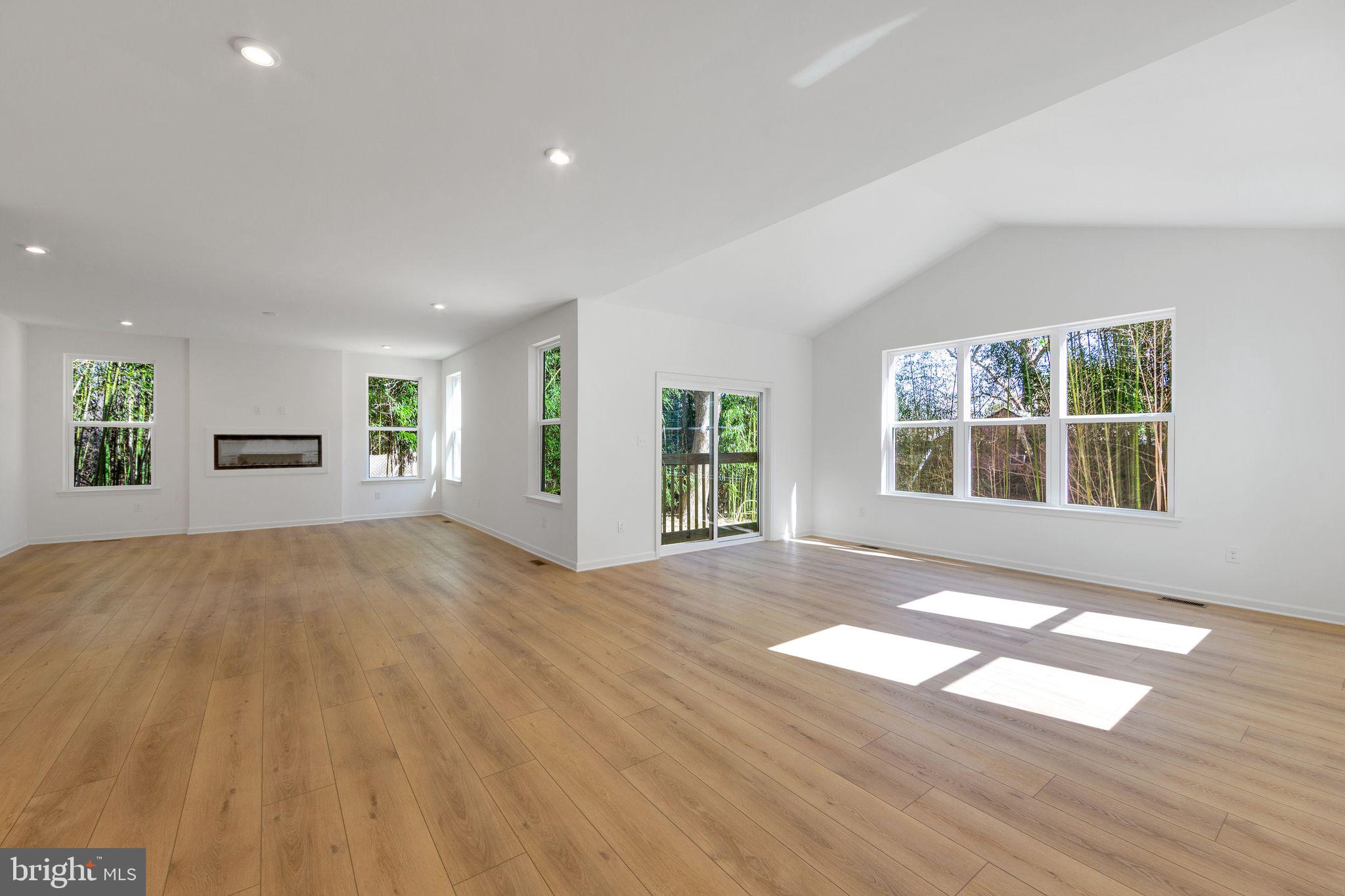 3455 B Durham Road Doylestown, PA 18902 - Photo 16 of 17 a view of an empty room with wooden floor and a window