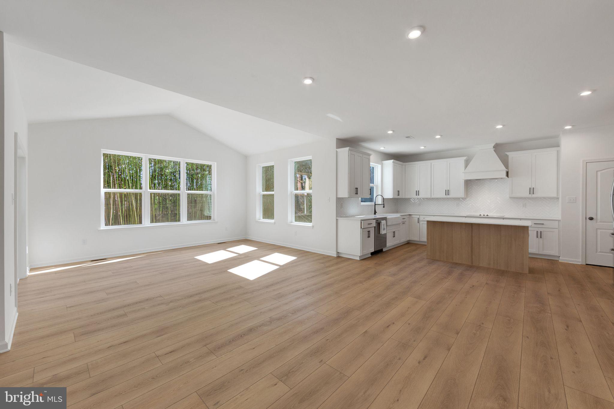 3455 B Durham Road Doylestown, PA 18902 - Photo 8 of 17 a view of an empty room with a window and wooden floor