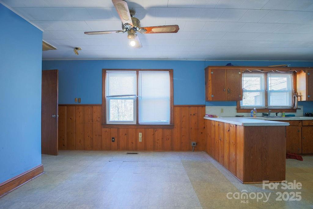 1218 Goodman Road Charlotte, NC 28214 - Photo 8 of 34 wooden floor in an empty room with a window