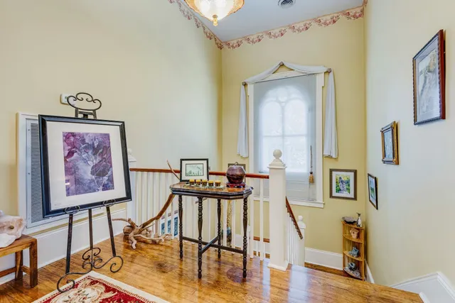 a view of a livingroom with furniture and workspace