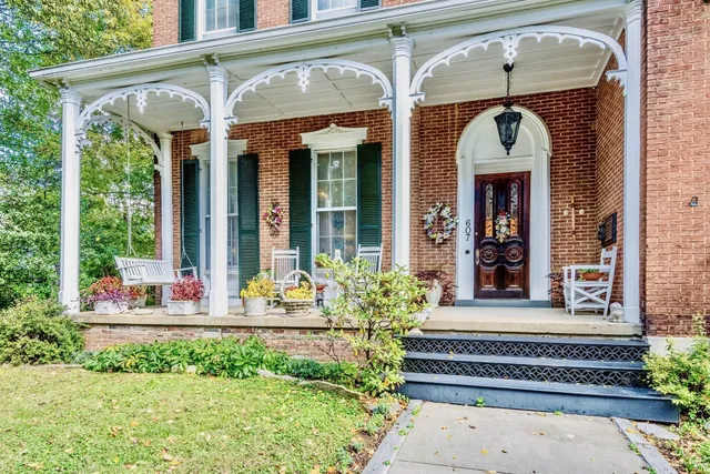 a front view of a house with a porch
