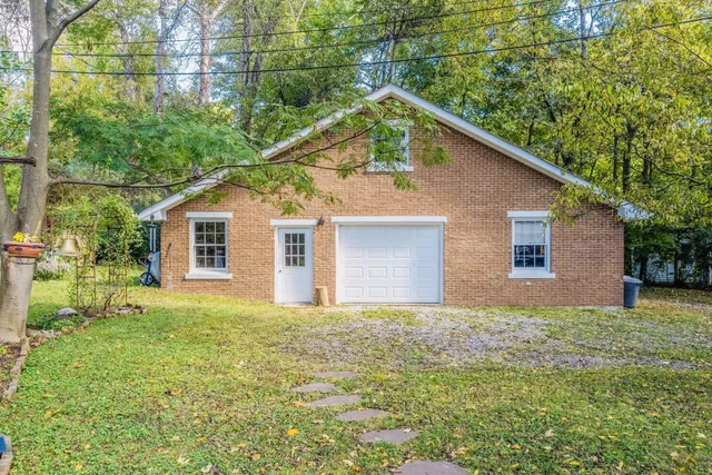 a view of house with outdoor space and seating area