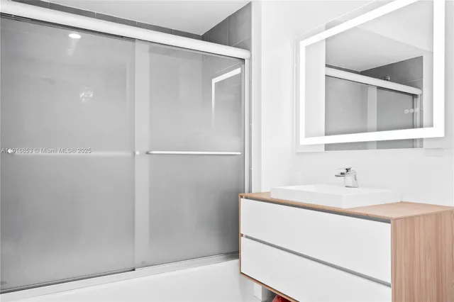 a bathroom with a sink and a mirror