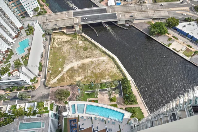 a swimming pool with outdoor seating and yard
