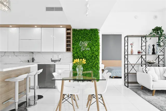 a view of a kitchen with furniture and chandelier