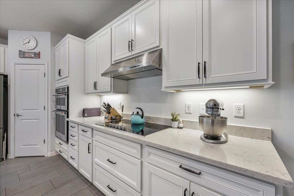8258 Northwest 79th Avenue Tamarac, FL 33321 - Photo 15 of 38 a kitchen with white cabinets and white appliances