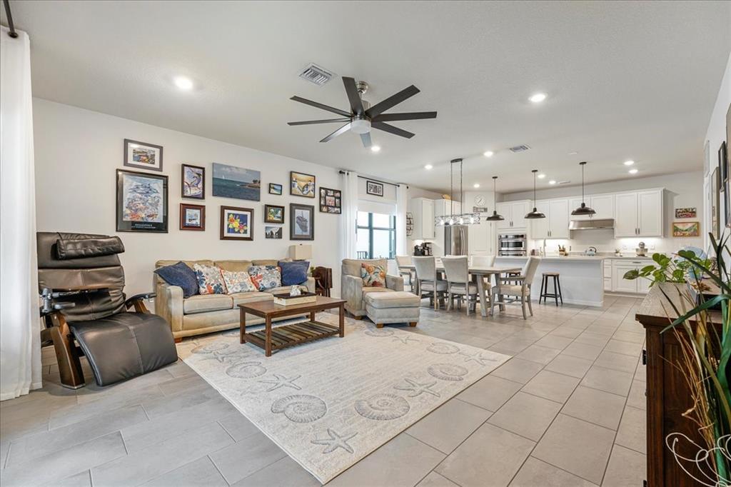 8258 Northwest 79th Avenue Tamarac, FL 33321 - Photo 17 of 38 a living room with furniture and kitchen view