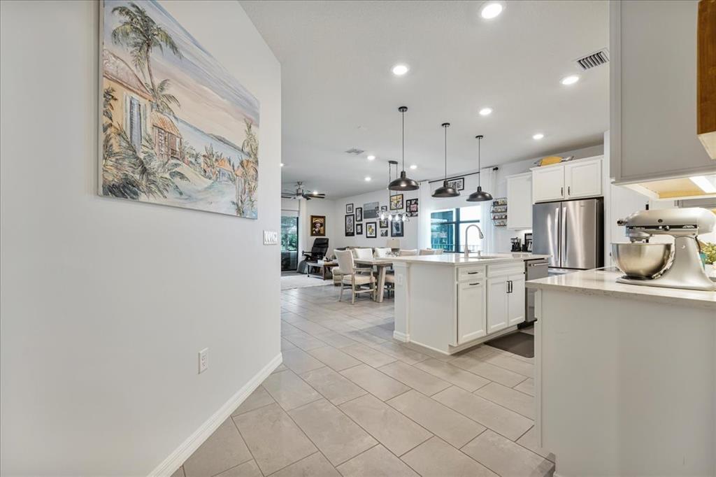 8258 Northwest 79th Avenue Tamarac, FL 33321 - Photo 23 of 38 a kitchen with cabinets and window
