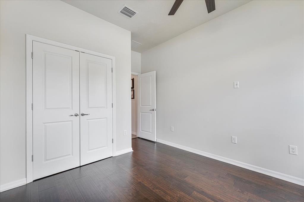 8258 Northwest 79th Avenue Tamarac, FL 33321 - Photo 24 of 38 a view of an empty room with a window and wooden floor