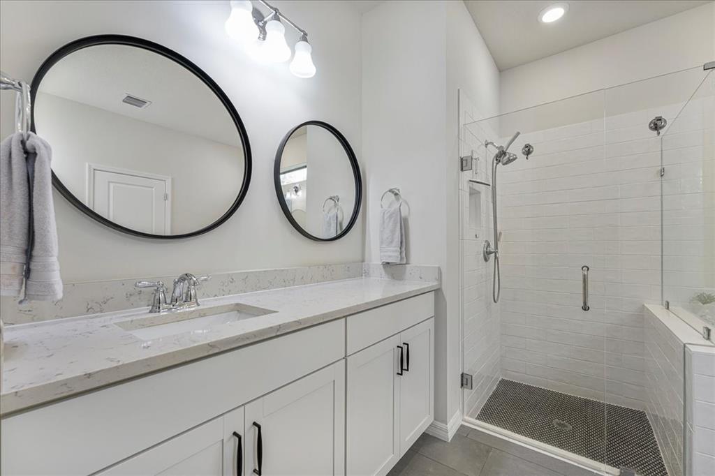 8258 Northwest 79th Avenue Tamarac, FL 33321 - Photo 26 of 38 a bathroom with a double vanity sink and a mirror