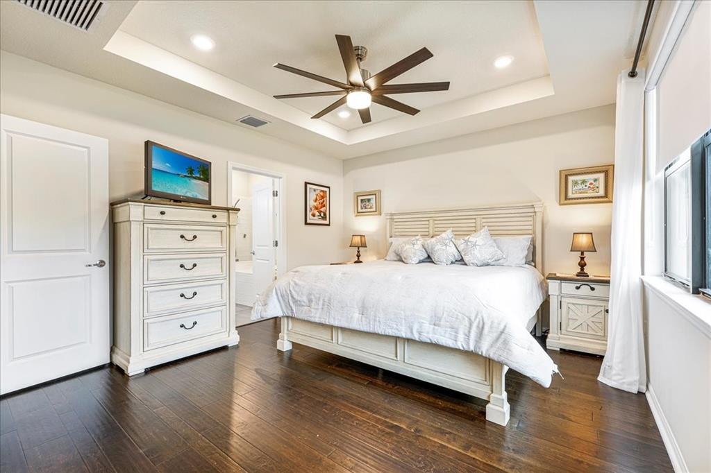 8258 Northwest 79th Avenue Tamarac, FL 33321 - Photo 28 of 38 a bedroom with a bed and a tv