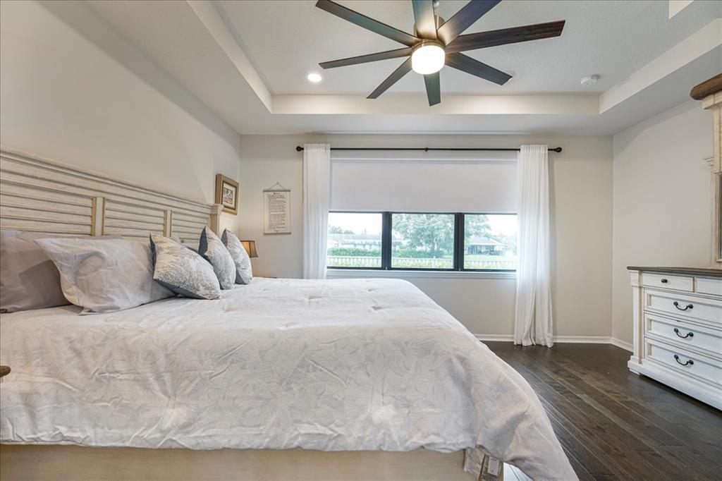 8258 Northwest 79th Avenue Tamarac, FL 33321 - Photo 29 of 38 a large bed sitting in a bedroom next to a window