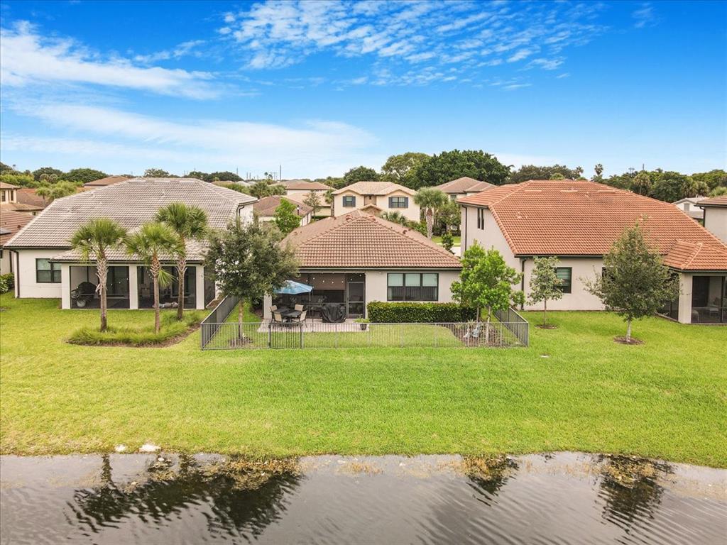 8258 Northwest 79th Avenue Tamarac, FL 33321 - Photo 8 of 38 a view of a city with lawn chairs under an umbrella
