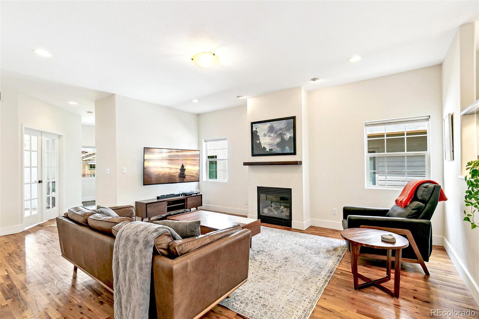 4530 Quitman Street Denver, CO 80212 - Photo 11 of 50 a living room with furniture and a fireplace
