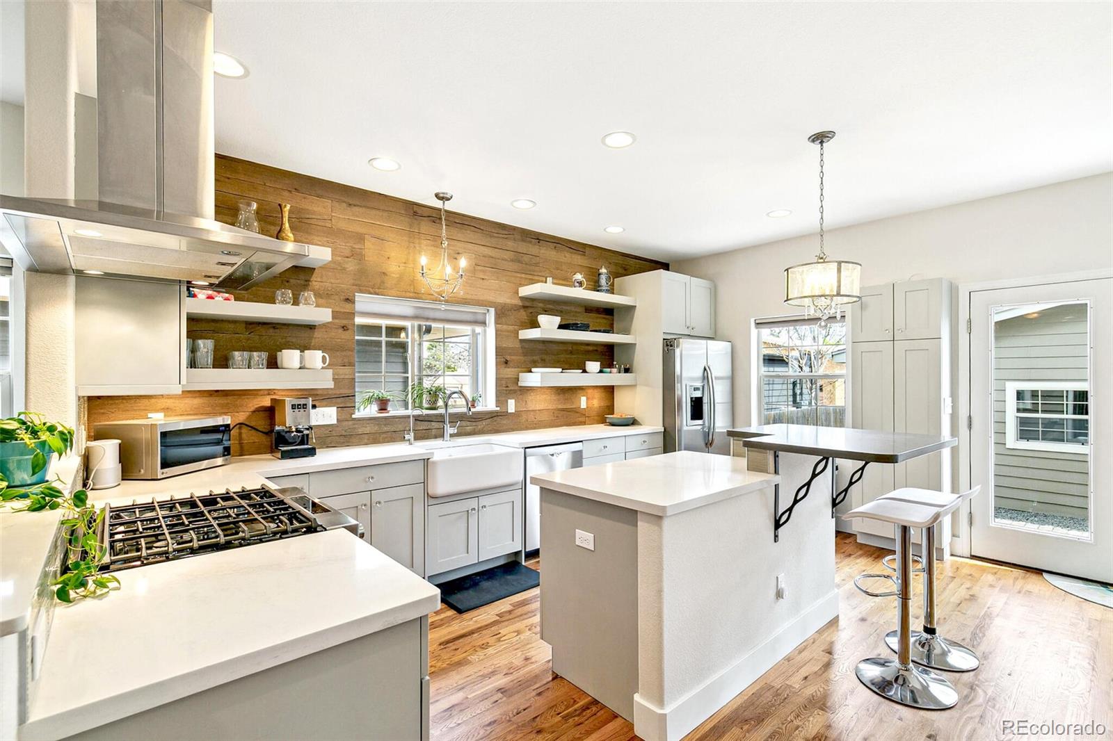 4530 Quitman Street Denver, CO 80212 - Photo 15 of 50 a kitchen with sink stove and cabinets
