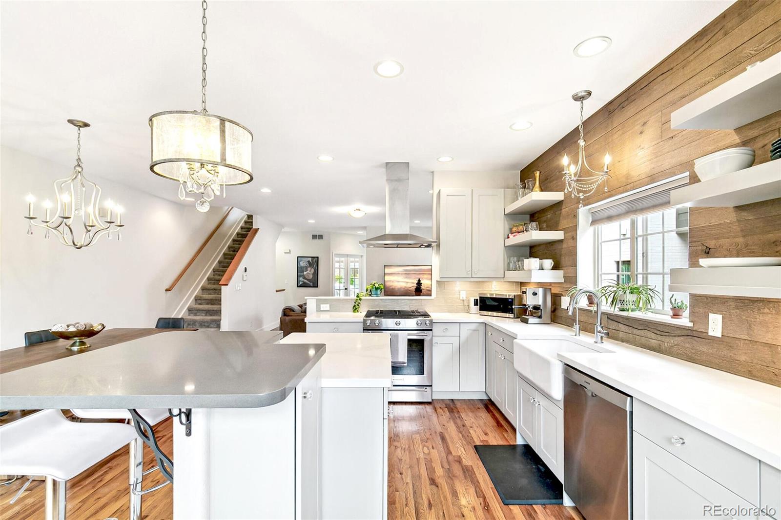 4530 Quitman Street Denver, CO 80212 - Photo 18 of 50 a kitchen with a sink a stove and cabinets