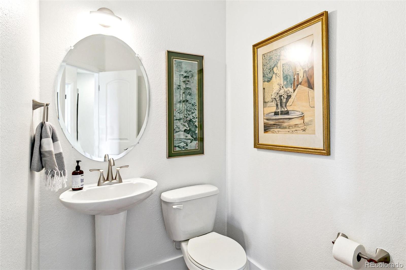 4530 Quitman Street Denver, CO 80212 - Photo 23 of 50 a bathroom with a toilet a sink and mirror