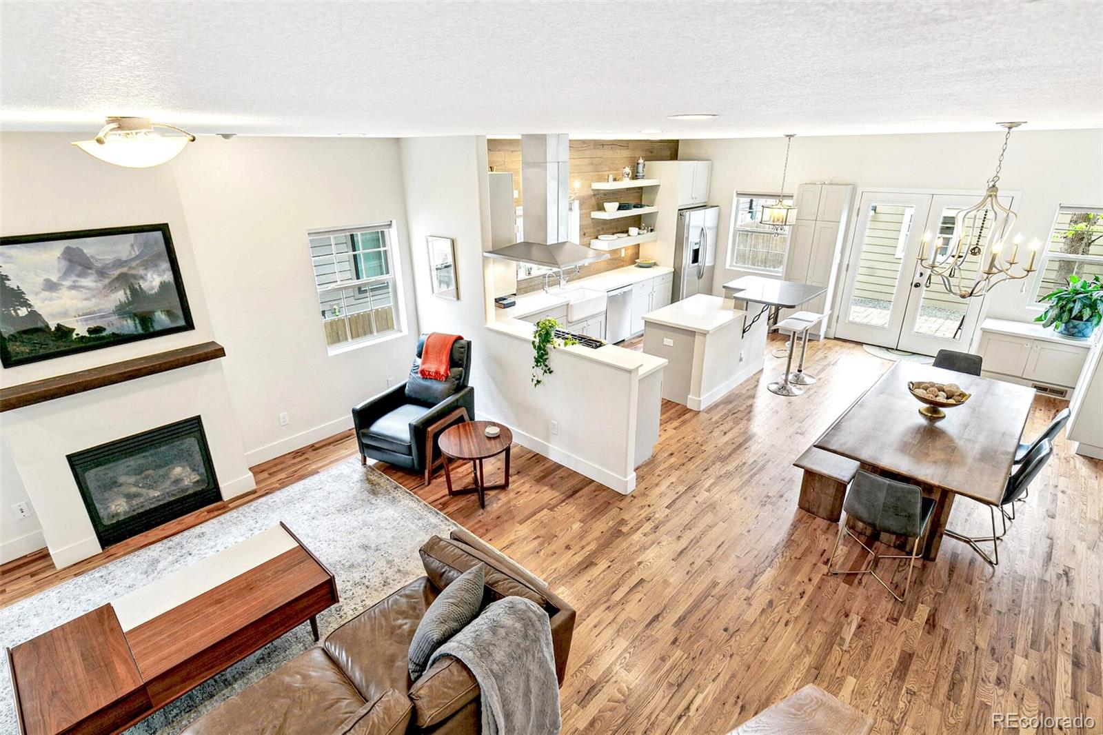 4530 Quitman Street Denver, CO 80212 - Photo 24 of 50 a living room with furniture fireplace and a flat screen tv