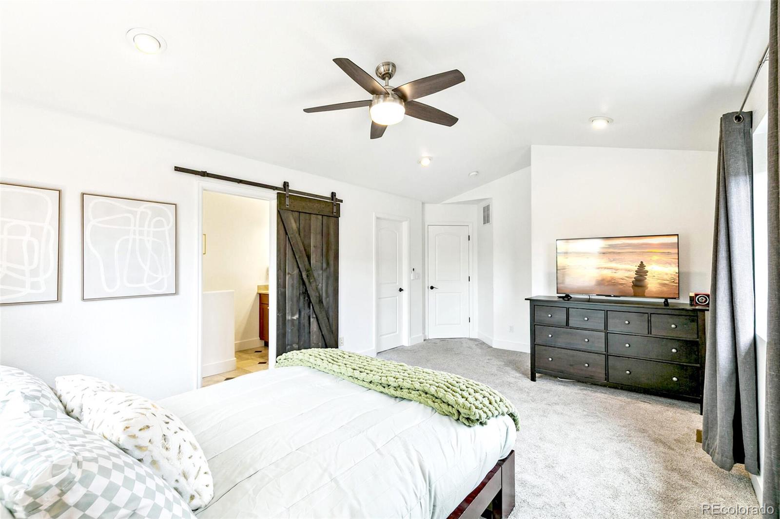 4530 Quitman Street Denver, CO 80212 - Photo 26 of 50 a bedroom with a bed and ceiling fan