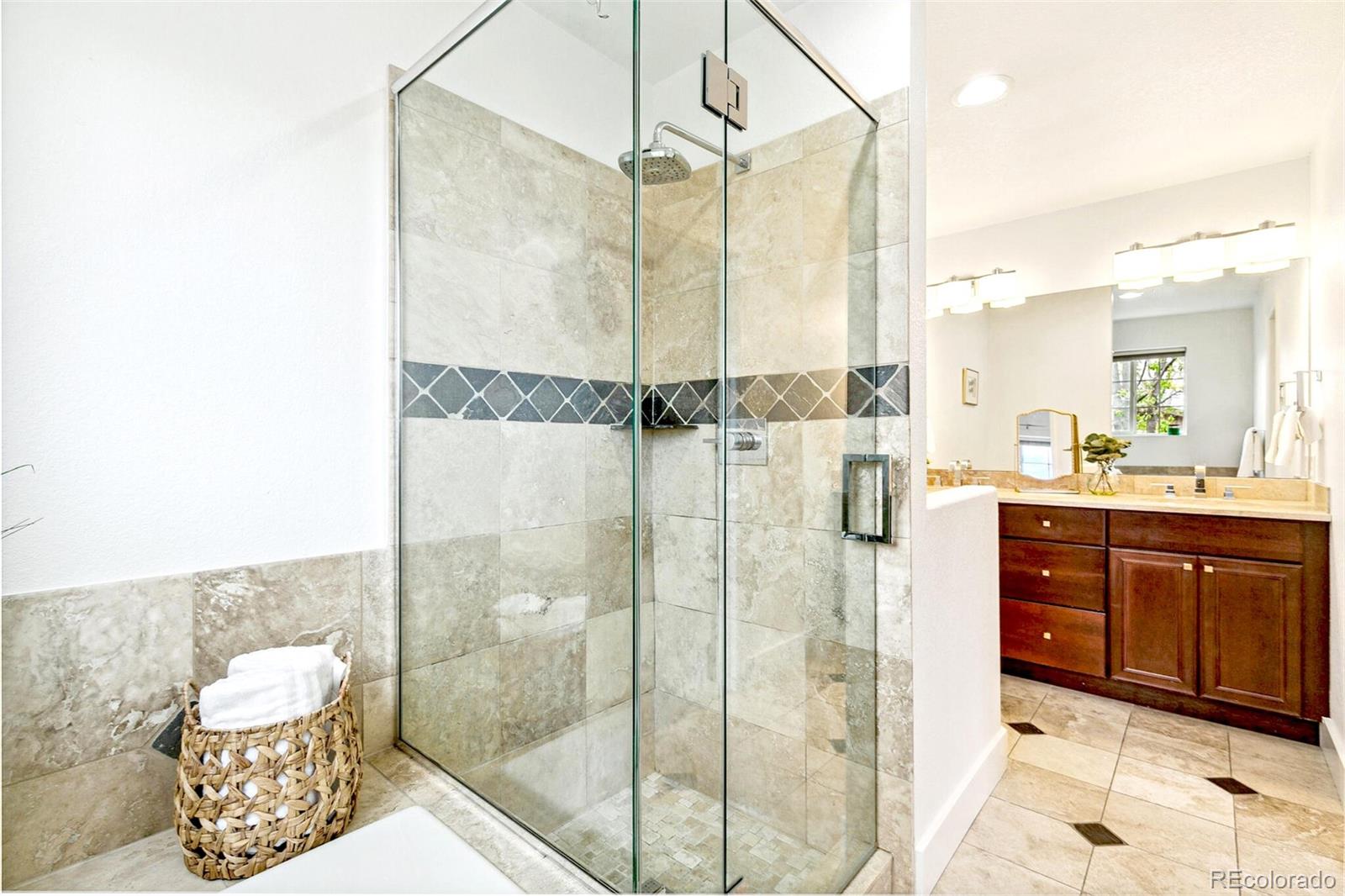 4530 Quitman Street Denver, CO 80212 - Photo 27 of 50 a bathroom with a shower sink and mirror