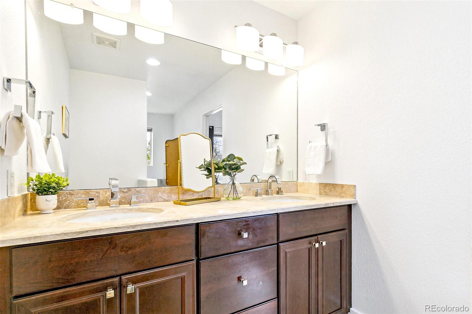4530 Quitman Street Denver, CO 80212 - Photo 29 of 50 a bathroom with a sink vanity and a mirror