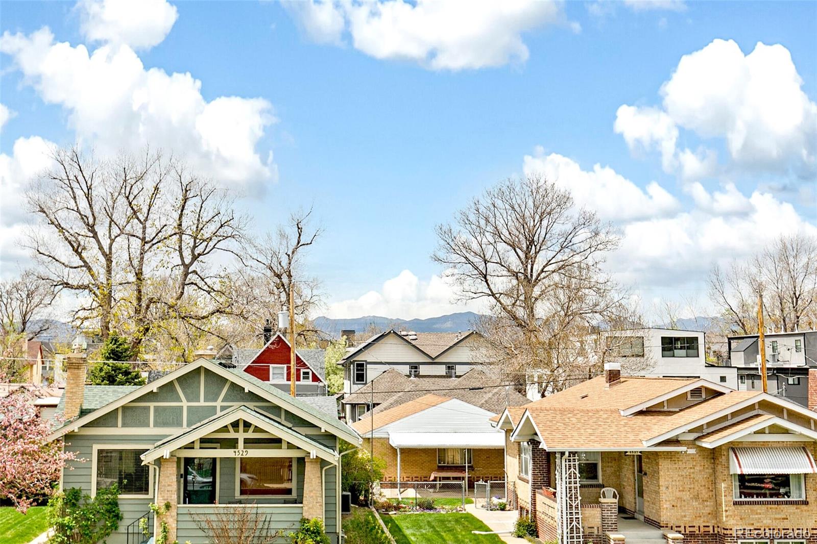 4530 Quitman Street Denver, CO 80212 - Photo 36 of 50 a front view of a residential apartment building with a yard