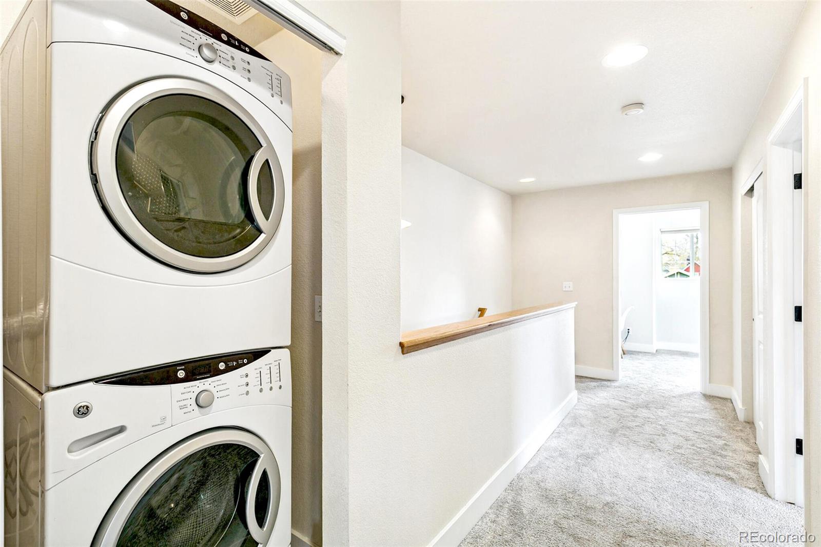 4530 Quitman Street Denver, CO 80212 - Photo 37 of 50 a view of a hallway with washer and dryer