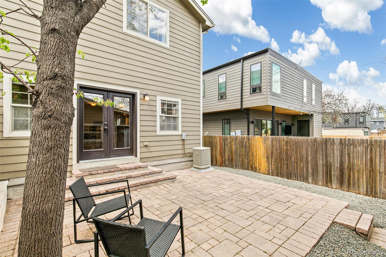 4530 Quitman Street Denver, CO 80212 - Photo 44 of 50 a view of a house with a chairs and table in a patio