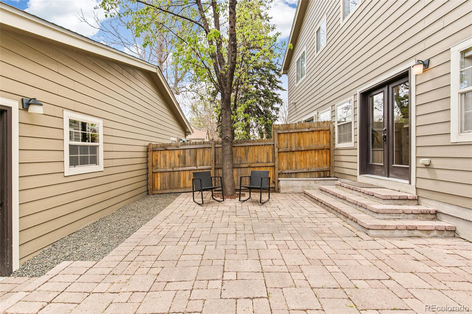 4530 Quitman Street Denver, CO 80212 - Photo 46 of 50 a backyard of a house with barbeque oven table and chairs