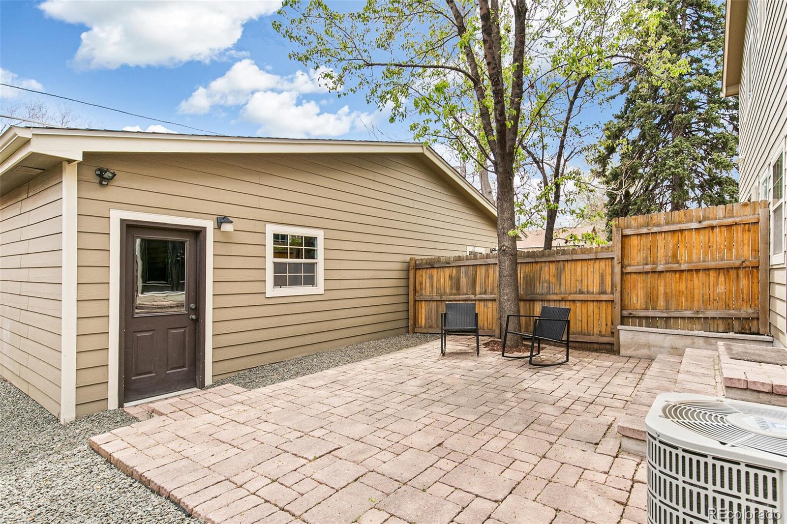 4530 Quitman Street Denver, CO 80212 - Photo 47 of 50 a backyard of a house with barbeque oven table and chairs