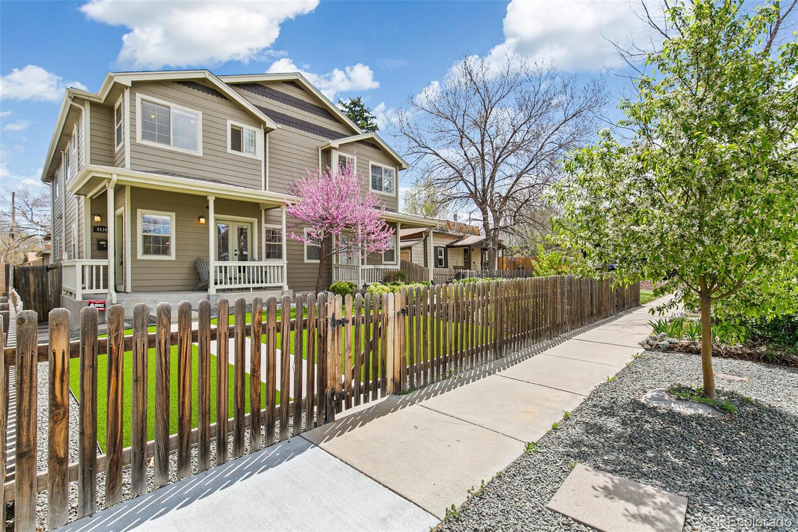 4530 Quitman Street Denver, CO 80212 - Photo 50 of 50 a view of a house with a small yard and wooden fence