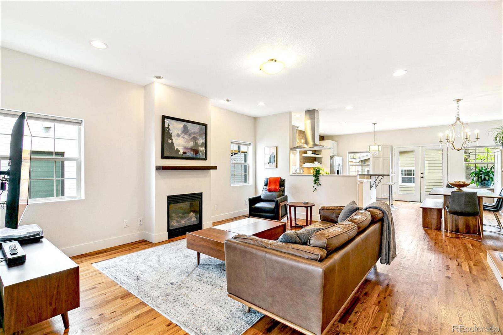 4530 Quitman Street Denver, CO 80212 - Photo 10 of 50 a living room with furniture and a fireplace