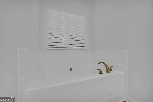 a bathroom with a bathtub
