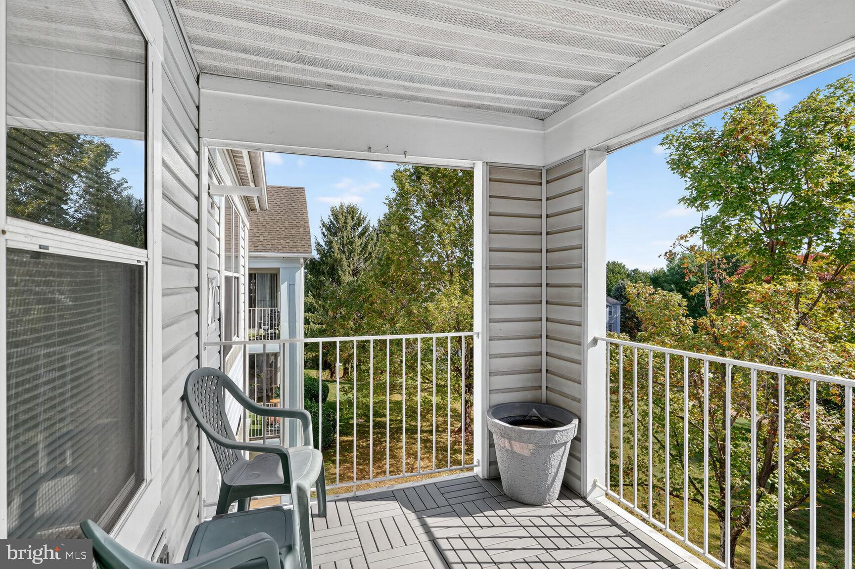 14101 Valleyfield Drive, Unit 114 Silver Spring, MD 20906 - Photo 13 of 26 a view of a chair and table in the balcony