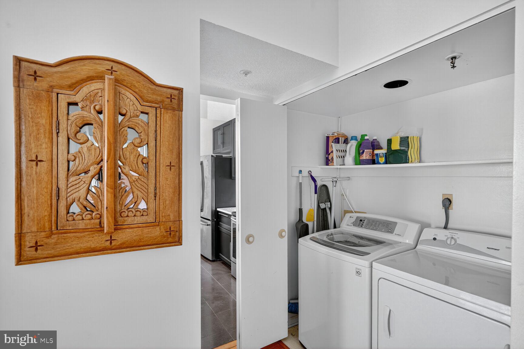 14101 Valleyfield Drive, Unit 114 Silver Spring, MD 20906 - Photo 15 of 26 a view of storage and utility room with washer and dryer