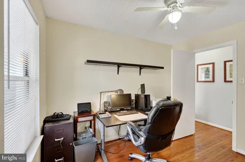 a workspace with furniture and wooden floor
