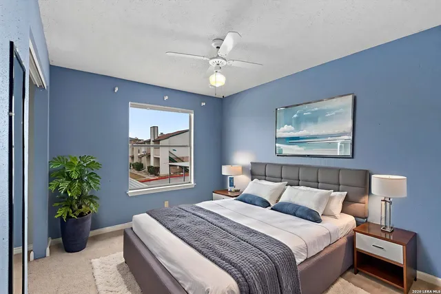 a bedroom with bed and a window