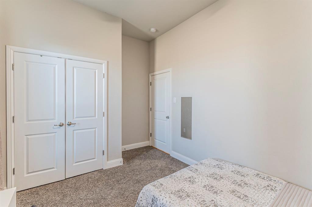 10638 Cherry Tree Way Grand Prairie, TX 76065 - Photo 23 of 39 Another view of guest bedroom 2 featuring the walk-in closet