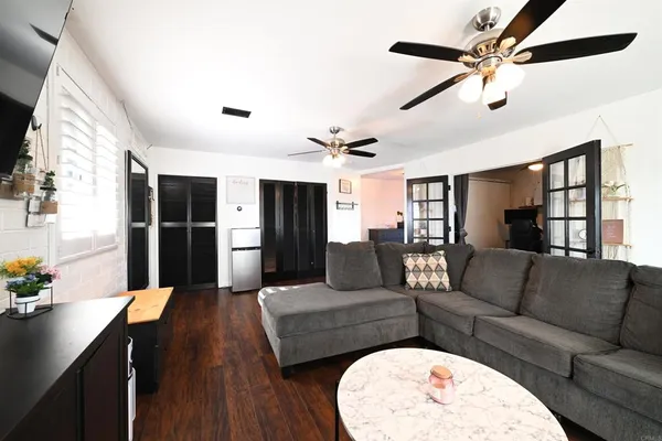 a living room with furniture and a large window