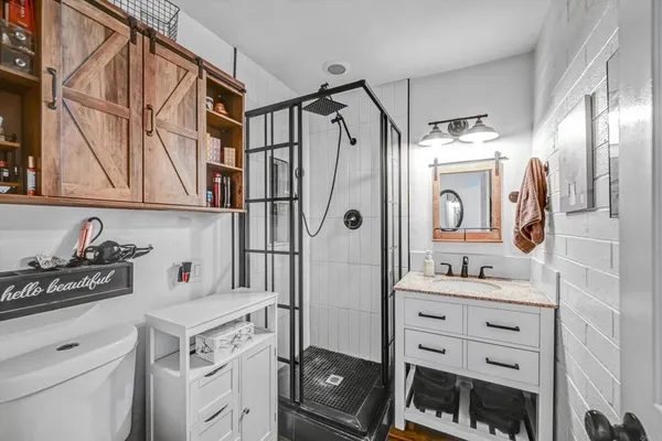 a kitchen with a sink and a refrigerator
