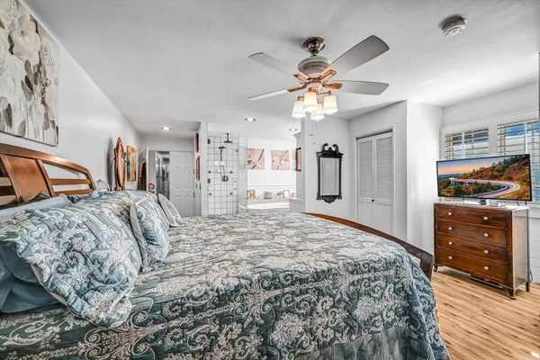 a bedroom with a bed and a walk in closet
