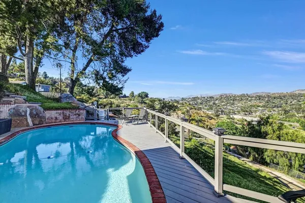a view of a balcony with an ocean