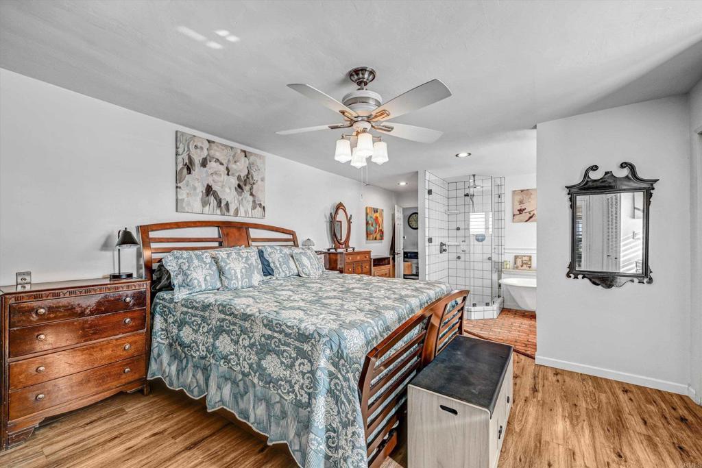 1308 Sundale Road El Cajon, CA 92019 - Photo 35 of 70 a bedroom with a bed and a chandelier