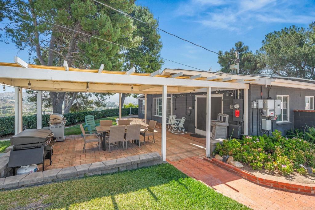 1308 Sundale Road El Cajon, CA 92019 - Photo 39 of 70 a view of a patio with couches table and chairs and potted plants